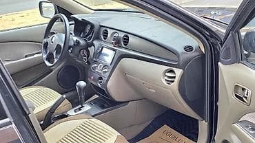 qara maşın: Mitsubishi Outlander – şəhər və yolsuzluq üçün praktik krossover. - — 8