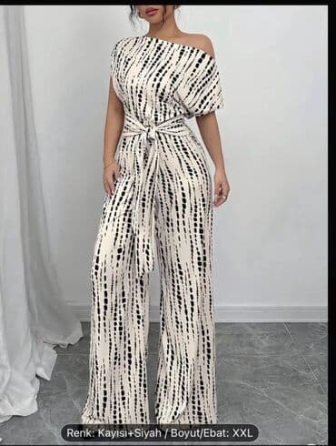 Çimərlik geyimləri: Ağ və qara rənglərdə, damcı naxışlı qadın kombinezonu. Bir çiyinli — 1