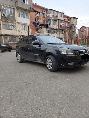 opel astra universal: Kia Rio – hetçbek, qara rəng Xüsusiyyətlər: - Kuzov: 5 qapılı — 2