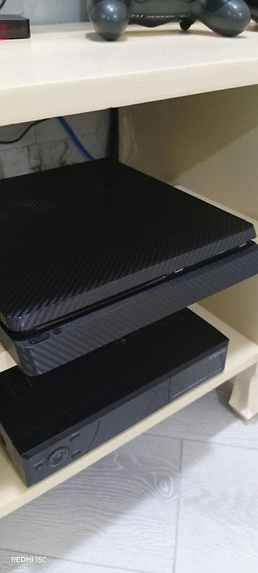 Yaxşı vezyetde versiya 12.50 yaddaş 1tb 2 jostik orginal içində 8 oyun