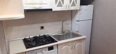 tam temirli menziller: İnşaatçılar metrosunun çıxısında inşaat binasında 12 mertebeli — 22