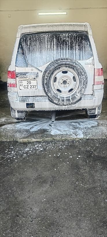 lider diskleri: Mitsubishi Pajero ıo 2002 1.8 (5 qapı) – gümüş rəngdə kompakt — 4