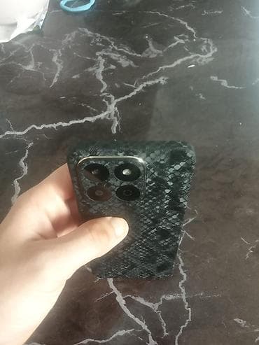 Мобильные телефоны и аксессуары: Barter. var.Qara rəngli, naxışlı arxa örtüyə malik smartfon. Cihazın — 2