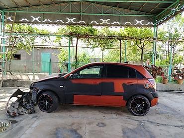 Kia Rio hatchback (CRDI, Sport paket yazıları ilə). Narıncı-qara iki lalafo.az -da Kia Rio hatchback (CRDI, Sport paket yazıları ilə). Narıncı-qara iki