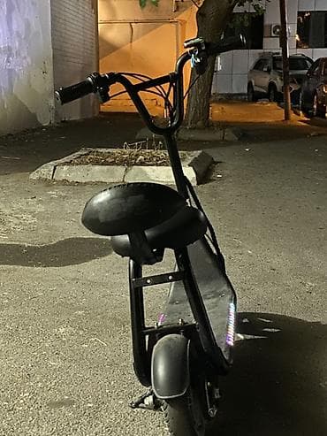 Oturacaqlı elektrik skuter -saatda 20 km surerle hereket edir — 4
