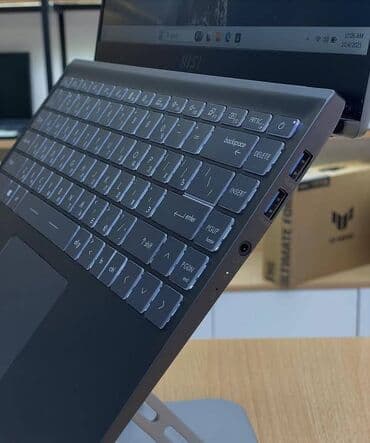 a 11: MSI ultrabook – zərif və yüngül metal gövdə, tünd boz rəng. 14″ nazik — 3