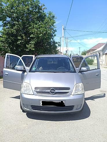 15 lik disklər: Opel Meriva: 1.4 l | 2005 il 400000 km Van/Minivan — 4