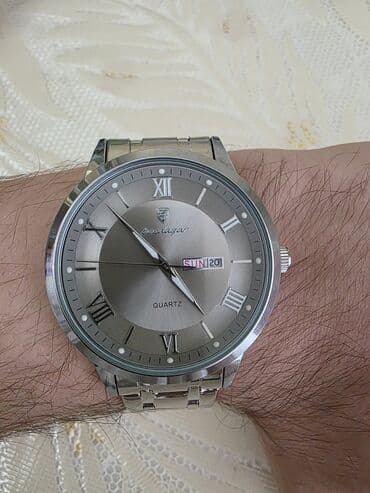 Şəxsi əşyalar: 🕰️ Mexanizm: Kvars (Quartz) 📅 Təqvim: Gün və tarix göstəricisi (Gün / — 2