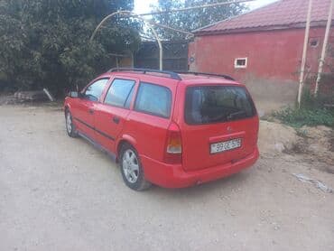 oturacaq uzlukleri: Model: Opel Astra Caravan (Universal kuzov) Rəng: qırmızı Kuzov: 5 — 3