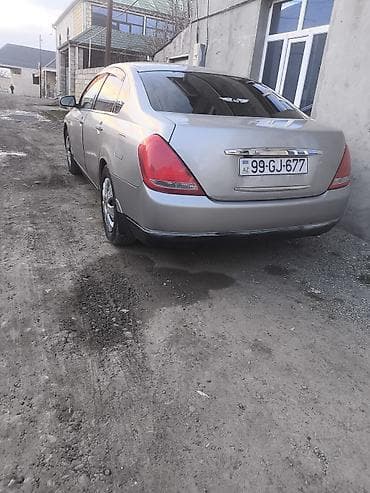 cd disklər: Nissan Teana – gümüşü sedan Xüsusiyyətlər: - Korpus: 4 qapılı sedan — 2