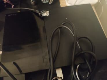 disklərin satışı: Sony PlayStation 2 Slim (PS2) oyun konsolu paketi Daxildir: - PS2 — 5