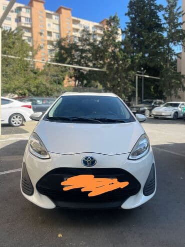 masin turbo az: Toyota Aqua (hibrid) – ağ rəngli, 5 qapılı heçbek. Tayota aqua 2019 — 2
