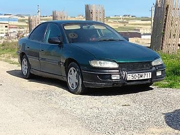 Opel Omega sedan - Kuzov: 4 qapılı sedan, tünd yaşıl rəng - Nömrə