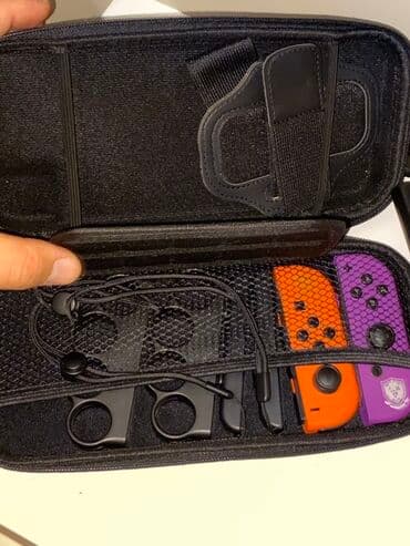 sazz lite modem: Nintendo Switch oyun konsolu – qara gövdə, ağ Joy‑Con panelləri ilə — 4