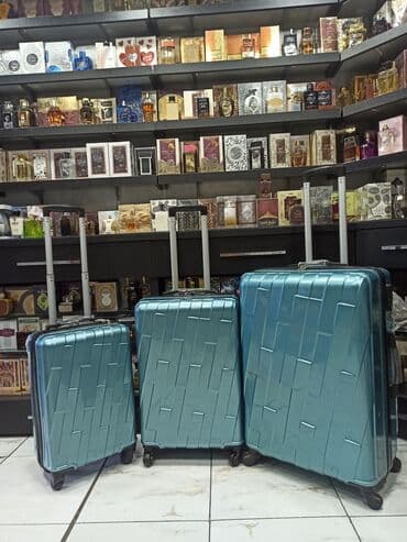 yol cantası: Material polikarbonat.S-50azn. M-80azn. L-110azn Camadan — 1