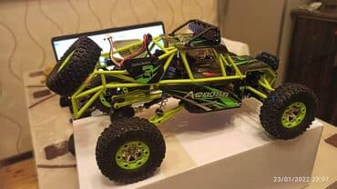 rc car: Wltoys 12428 Rc Car 1/12 Scale. 4WD .2.4Ghz 5Km/h speed.540 Brushed — 8