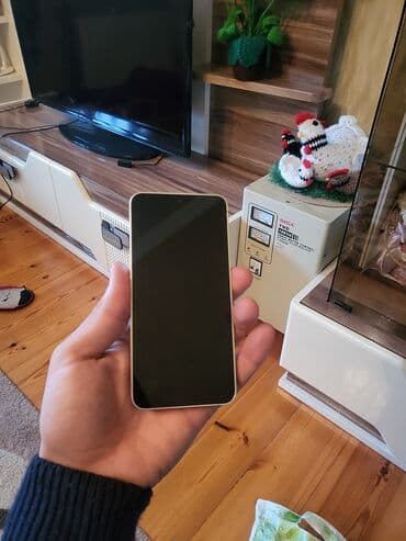 tikanlı tel: Samsung Galaxy S24, 128 GB, rəng - Bej, Simsiz şarj — 9