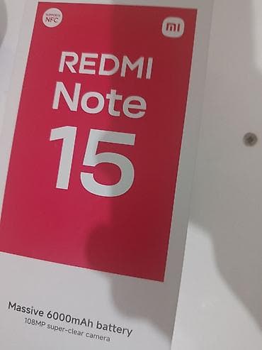 mini smart phone: Arxa tərəfində "REDMI" brendi və "108MP" yazısı olan qara rəngli — 7