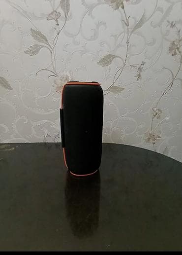 kalonka temiri: Daşınan Bluetooth akustik kolonkadır. Silindr formalı, qara rəngdə — 3