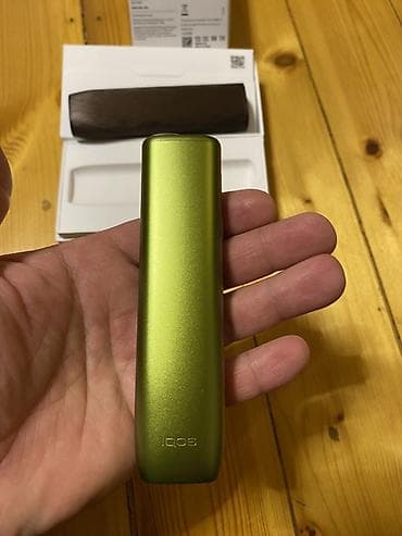 qelyan hqd: IQOS ILUMA ONE – tütün çubuqları üçün qızdırma cihazı ustunda kabro — 2