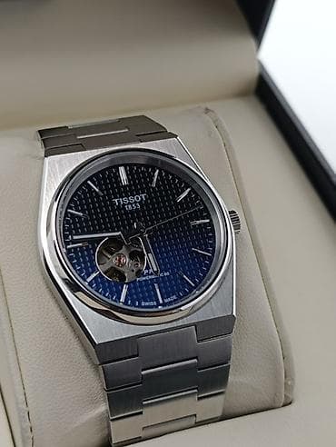 dini kartinkalar: Qol saatı, Tissot — 2