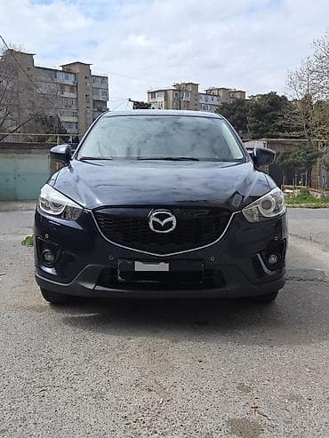 bmw x1 20d xdrive: Mazda CX-5: 2 l | 2014 il Krossover — 1