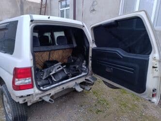 mtz 892 qiymeti: Mitsubishi Pajero IO – ağ rəngli, 5 qapılı kompakt SUV Maşının ancaq — 7