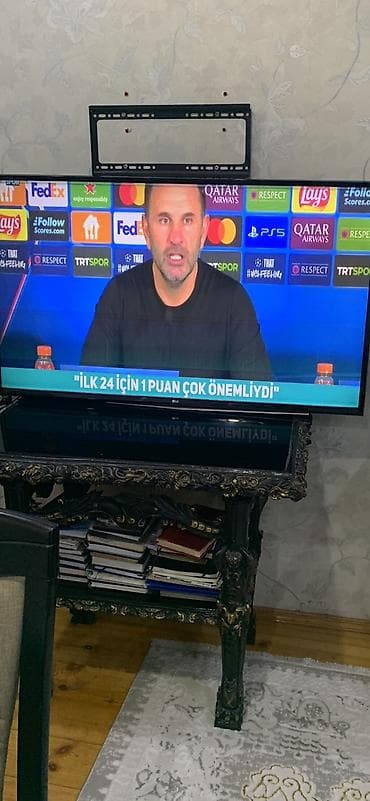 a 32 ekran: LG LED televizor (təxminən 43–50 düym) - Ekran: LED, Full HD/4K — 3