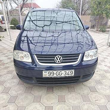 Volkswagen Touran – geniş və funksional ailə miniveni. Xüsusiyyətlər