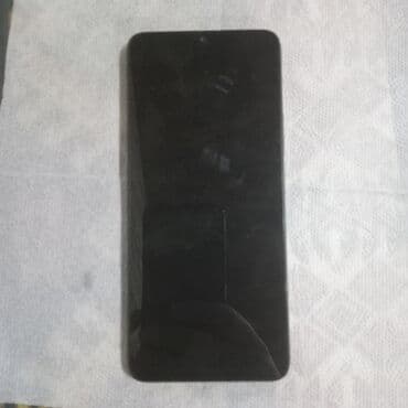 qara çanta: Redmi smartfon - Model: Redmi (arxa qapaqda “Redmi” loqosu və dairəvi — 2