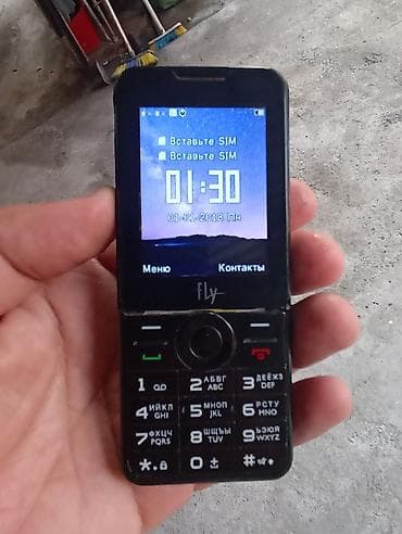60 kv kondisioner: Düyməli mobil telefon – Philips Xenium seriyası (ön paneldə Fly — 1