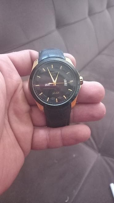 qanlı qol: Tissot Le Locle qol saatı - Klassik üslubda, qara siferblat və qızılı — 1