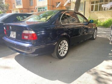 aston martin db7 5.9 at: BMW 5 series: 2.5 l | 2000 il Sedan — 5