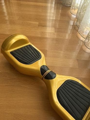 Elektrik nəqliyyatı: Qızılı rəngdə hoverboard (özünü tarazlayan skuter) Bele istemir amma — 2