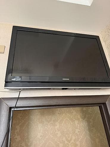 televizo: Grundig LCD televizor - Ekran: təxminən 32–37 düym diaqonal (şəkildən — 1