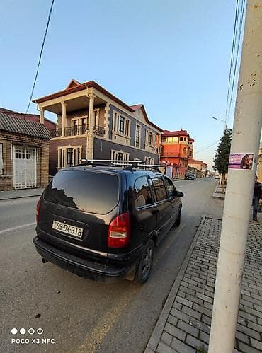 запчасти форд фокус 1: Opel Zafira A, qara rəng, 7 yerlik miniven. Xüsusiyyətlər: - Geniş — 3