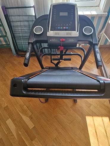 ems trainer: Evdə idman üçün nəzərdə tutulmuş qaçış bandı. Bu cihaz qara rəngdədir — 5