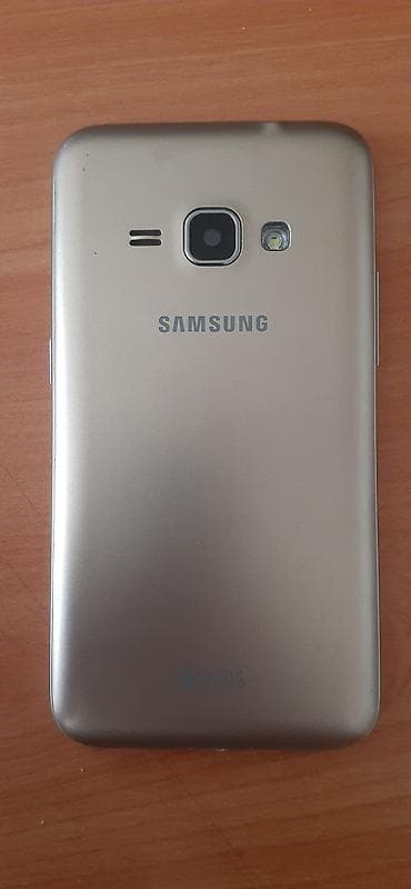 philips xenium 9@9d: Samsung Galaxy J1 Duos, 8 GB, rəng - Qızılı, İki sim kartlı — 3