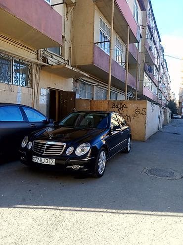 lider disk: Mercedes‑Benz E‑Class (W211) sedan – qara rəng, 4 qapı, 5 yerlik. - — 7