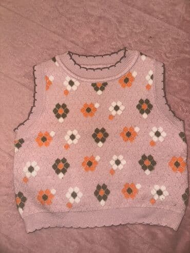 Uşaq üçün trikotaj jilet - Rəng: açıq çəhrayı əsas, üzərində narıncı