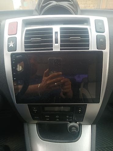 guzgusu: Hyundai Tucson (1-ci nəsil) krossover/SUV - Korpus rəngi: açıq gümüş — 10