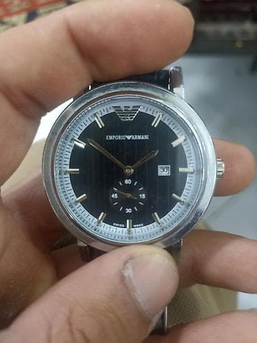 Emporio Armani kişi qol saatı - Klassik dairəvi korpus, parlaq metal