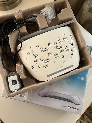 Modem Router TP-Link - Qutuda: Cihaz, güc adapteri, telefon xətti