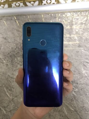 telefonun: Məhsul: Mavi rəngli smartfon Xüsusiyyətlər: - Ekran: çərçivəsi nazik — 2