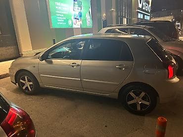 carolla disk: Toyota Corolla (E120) hatchback - Kuzov: 5 qapılı hatchback, gümüşü — 2