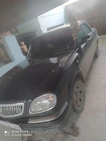 opel 1.5 dizel motor: GAZ-3110 Volga sedan - Kuzov: 4 qapılı sedan, qara rəng - Ön hissə — 1