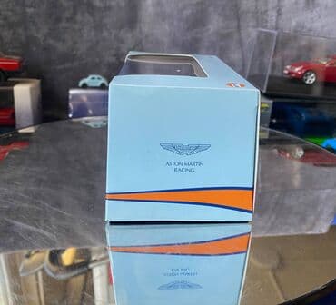 где можно продать марки: Коллекционная модель Aston Martin AMR-One #7 Gulf Team LeMans 2011 — 4