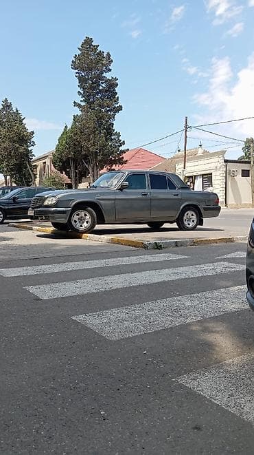 qara disk: GAZ Volga 31105 sedan - Kuzov: 4 qapılı sedan, tünd boz rəng, xrom ön — 7