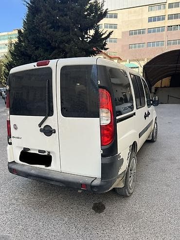 fiad doblo: Fiat Doblo (ağ rəng) – praktik və funksional miniven Xüsusiyyətlər: - — 7
