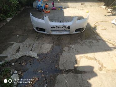 banper: Ön, Chevrolet Aveo, 2011 il, ABŞ, Ünvandan götürmə — 1